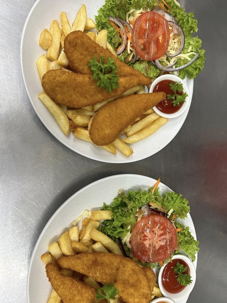 Crumbed chicken tenders with fries and a fresh garden salad